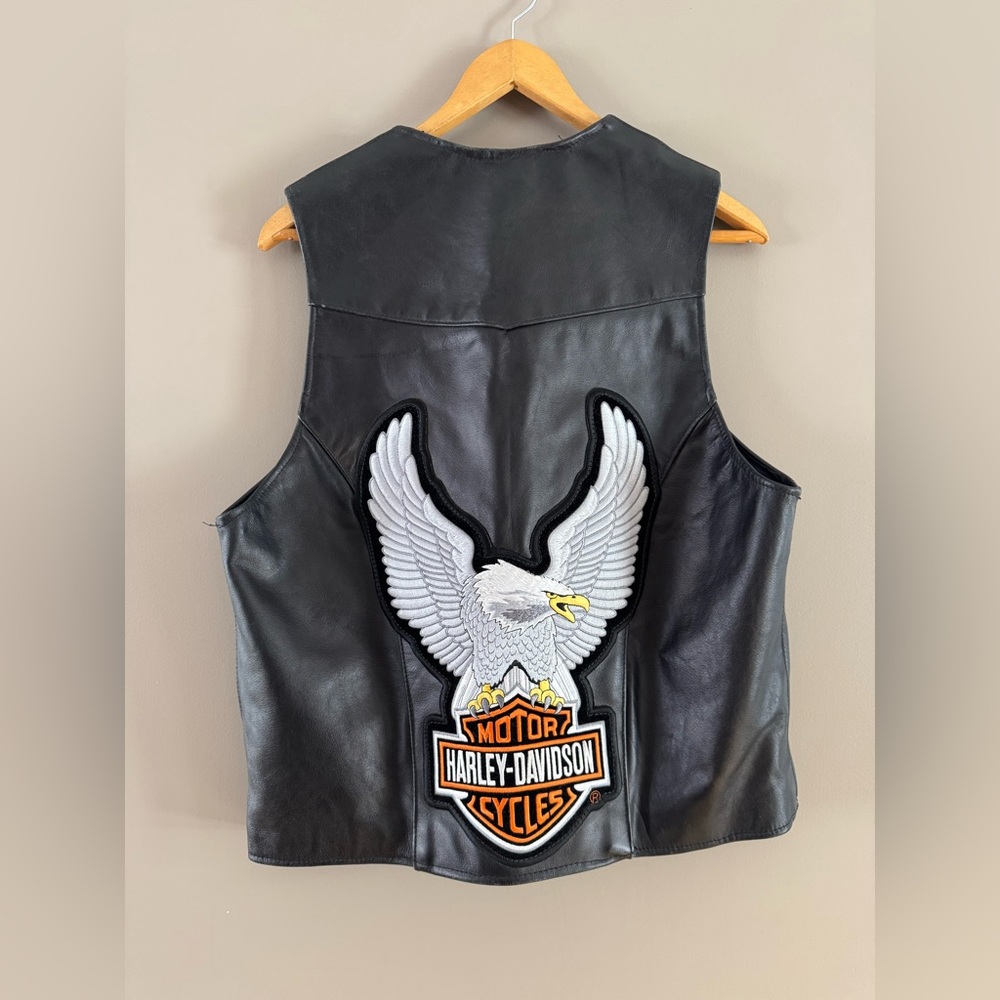 Black Leather Vest with Harley Davidson Orange and White Patch on Back